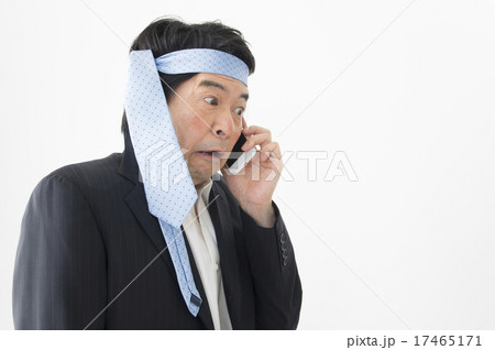 酔っ払い ネクタイ 頭 ビジネスマンの写真素材