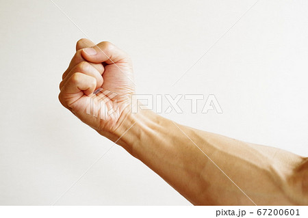 振り上げる 拳の写真素材