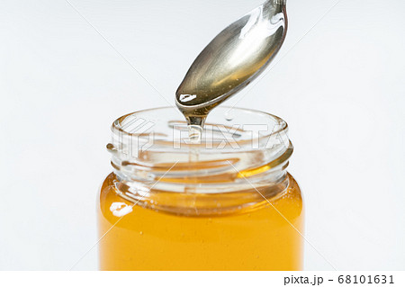 スプーン 蜂蜜 垂れる ハチミツの写真素材