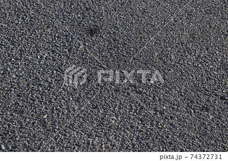 道路 地面 アスファルト 小石の写真素材