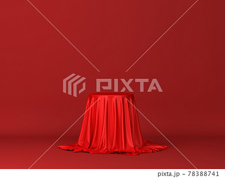 Cube or box covered with red silk cloth isolated on white