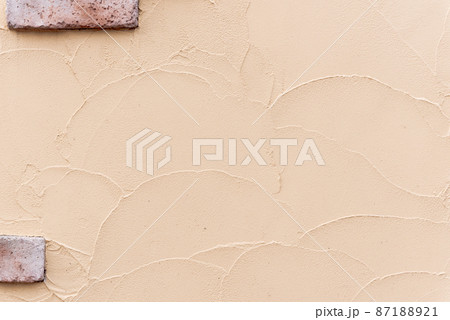 テクスチャ素材=明るいオレンジ色の塗り壁と煉瓦