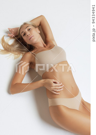 Naked women in panties hugging on beach - Stock Photo [81729889] - PIXTA
